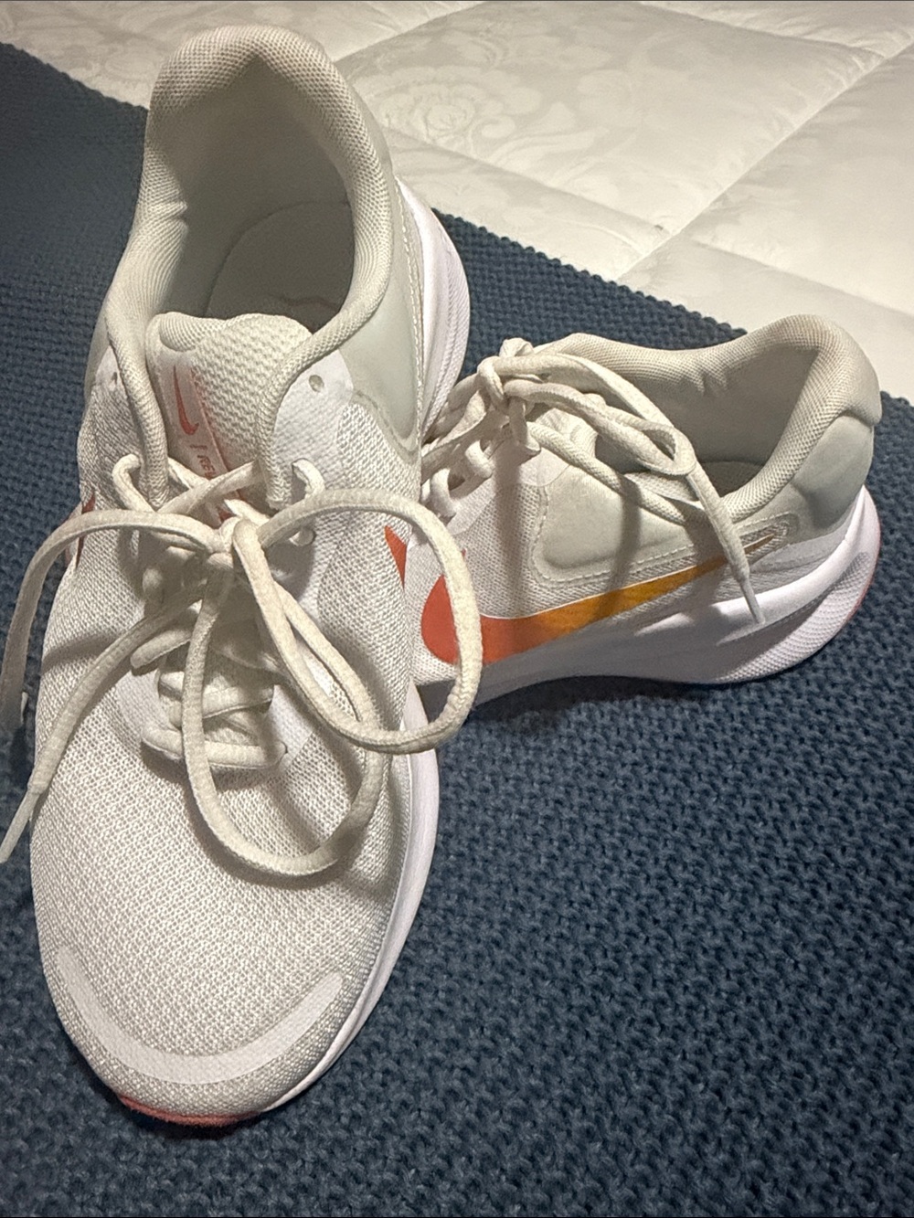 Nike Women's White Running Shoes with Orange Gradient Swoosh